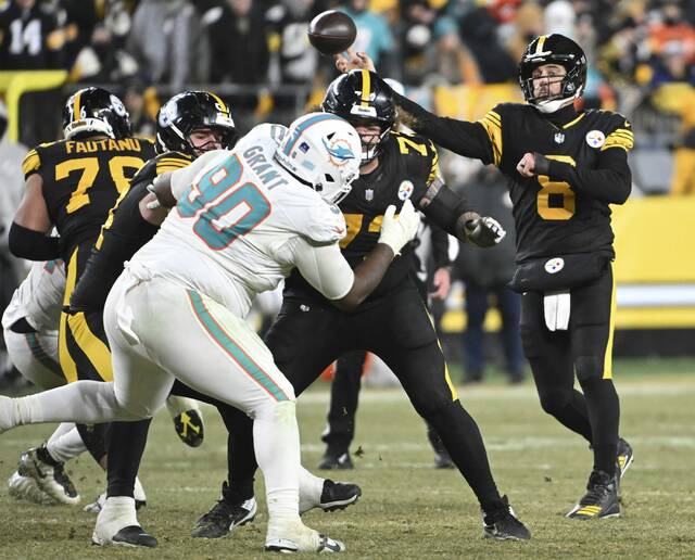 Steelers quarterback Aaron Rodgers throws a touchdown pass to DK Metcalf against the Dolphins in the third quarter Monday, Dec. 15, 2025 at Acrisure Stadium. (Chaz Palla | TribLive)