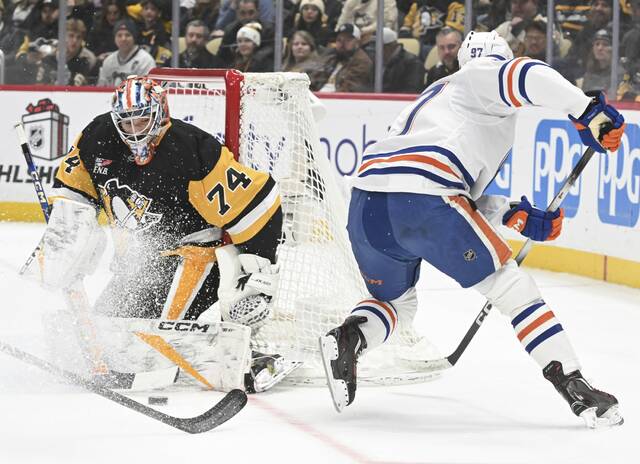 Penguins goaltender Stuart Skinner makes a save on Edmonton Oilers forward Connor McDavid in the second period Tuesday at PPG Paints Arena. (Chaz Palla | TribLive)